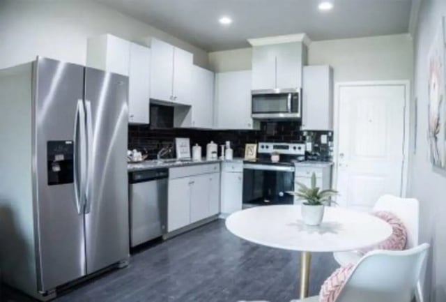 Modern kitchen with stainless steel appliances and table Kitchen at 625 at Prairie View Apartments in Prairie View Student Accommodation
