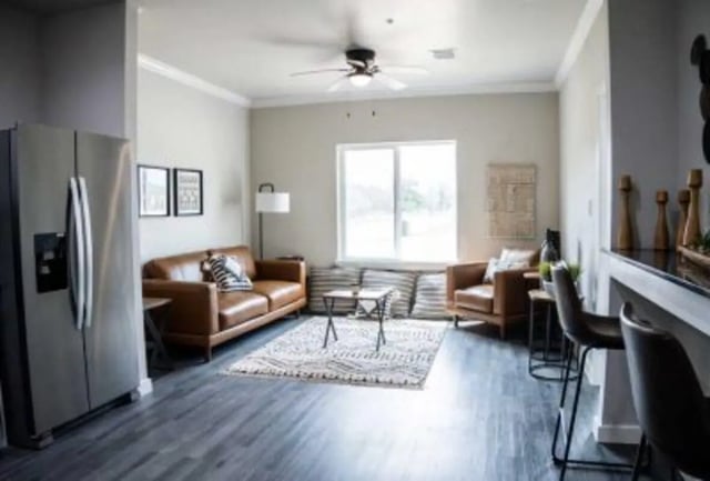 Stainless steel fridge leather sofas modern living area living room at 625 at Prairie View Apartments in Prairie View Student Accommodation