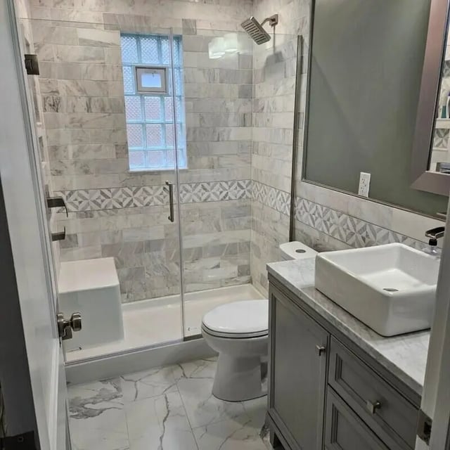 Modern bathroom with glass shower toilet sink vanity bathroom at 142 Ashley St - Ashley House Apartments in Dayton Student Accommodation