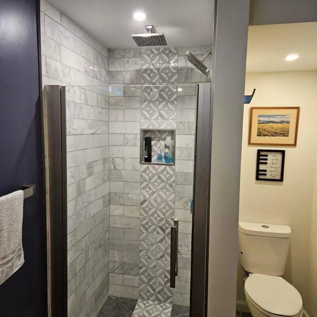 Shower stall toilet art framed decor bathroom at 142 Ashley St - Ashley House Apartments in Dayton Student Accommodation