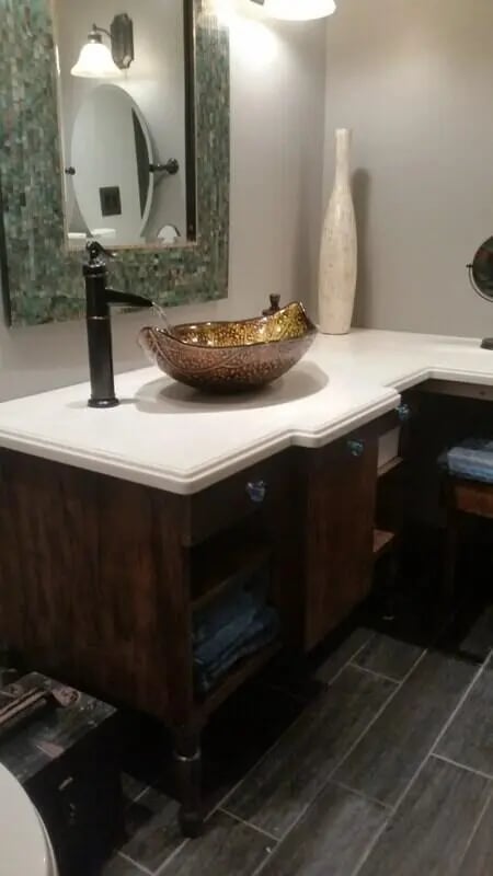 Ornate bowl sink with dark wood vanity bathroom at 142 Ashley St - Ashley House Apartments in Dayton Student Accommodation