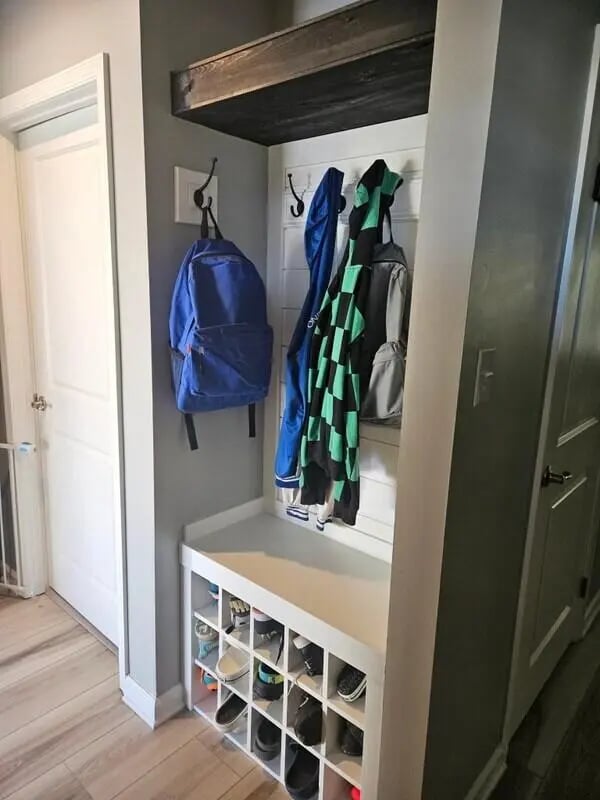 Backpacks coats and shoe rack entryway storage area at 142 Ashley St - Ashley House Apartments in Dayton Student Accommodation