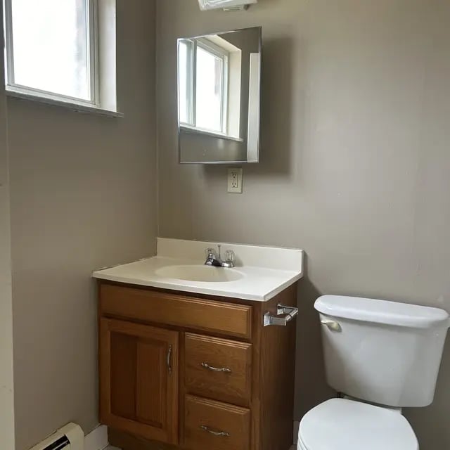 Sink cabinet mirror and toilet bathroom at Adams House in Oxford Student Accommodation