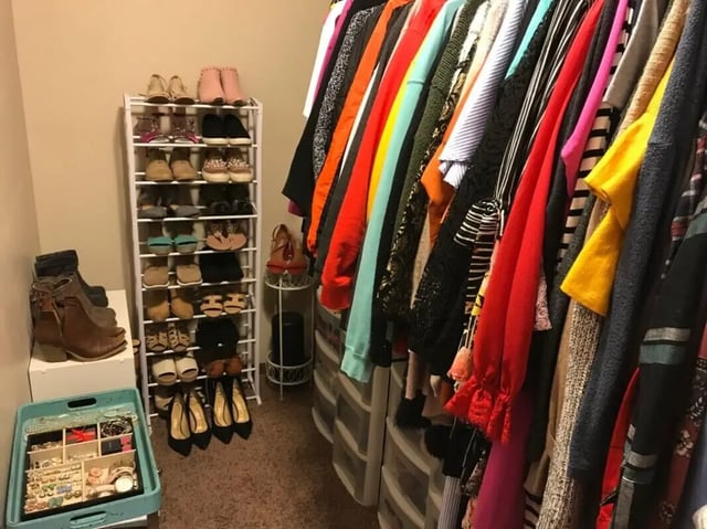 Closet with shoes and hanging clothes interior at Clarks Landing Apartments in Vermillion Student Accommodation
