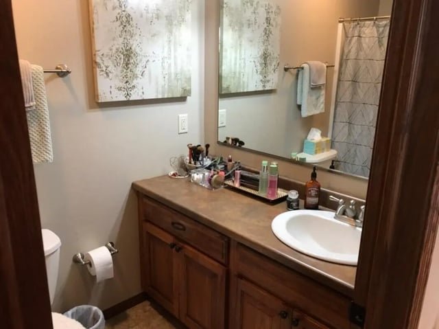 Counter with sink and makeup bathroom at Clarks Landing Apartments in Vermillion Student Accommodation
