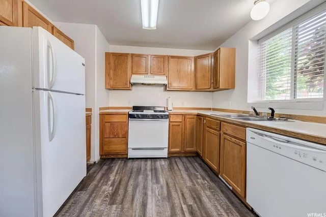 Fridge stove cabinets countertops sink dishwasher kitchen at Alpine Canyon Student Housing - Snow College in Ephraim Student Accommodation