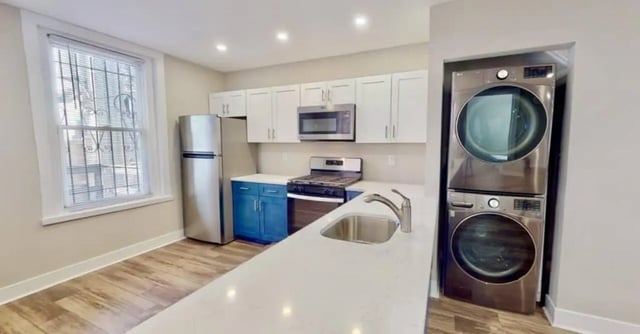 Refrigerator stove microwave washer dryer kitchen at Campus Apartments Philadelphia in Philadelphia Student Accommodation