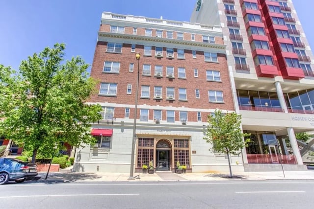 Brick building with entryway and trees exterior at Campus Apartments Philadelphia in Philadelphia Student Accommodation