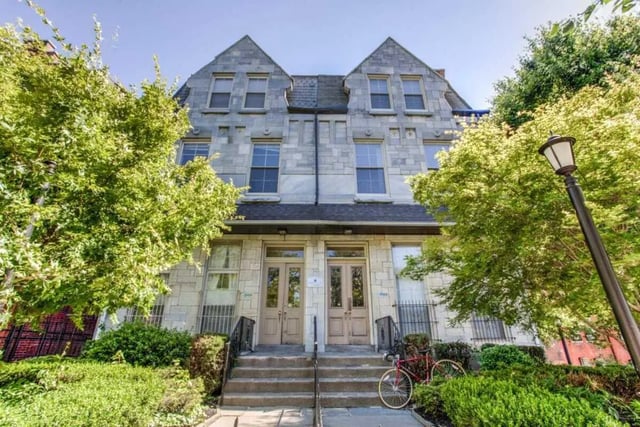 Double doors on stone building surrounded by trees exterior at Campus Apartments Philadelphia in Philadelphia Student Accommodation