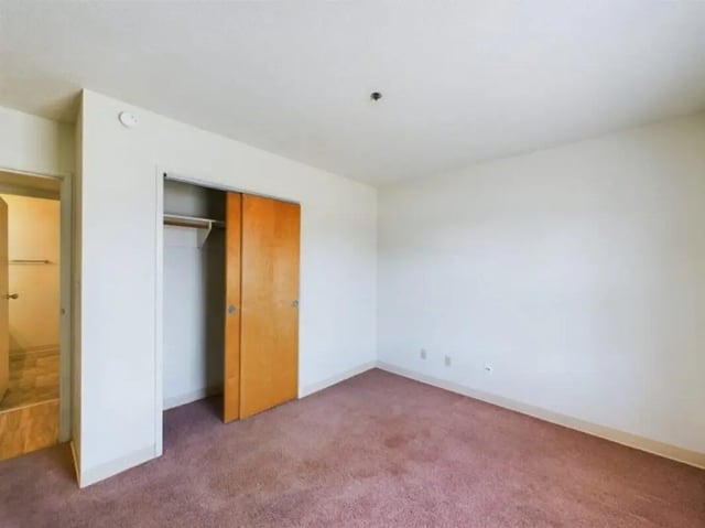 Closet open showing empty space bedroom at Chesterfield Apartments Muncie in Muncie Student Accommodation