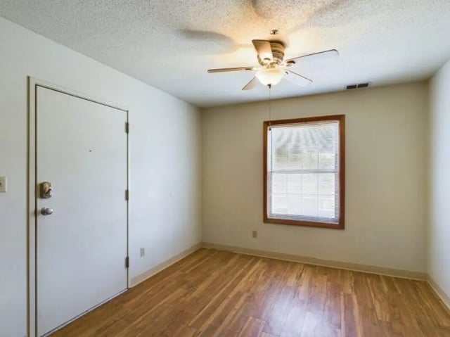Door fan window wooden floor interior living room at Chesterfield Apartments Muncie in Muncie Student Accommodation
