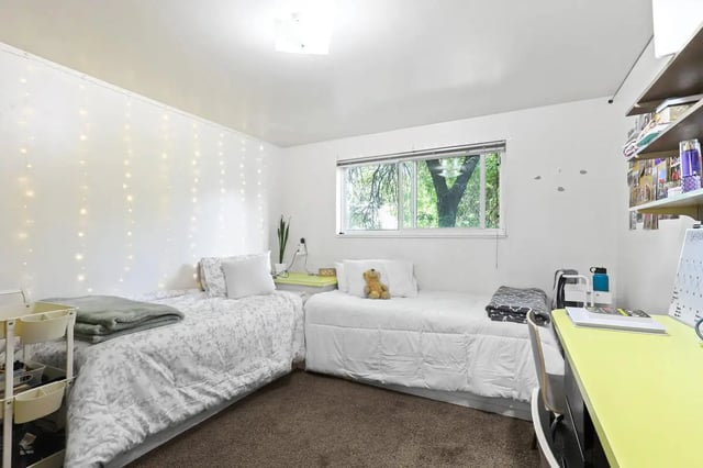 Two beds fairy lights and desk bedroom at Alpine Flats (NOW UNIVERSITY LANDING) in Logan Student Accommodation