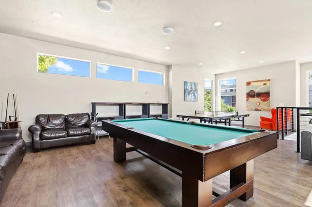 Pool table sofas ping pong tables recreation room at Alpine Flats (NOW UNIVERSITY LANDING) in Logan Student Accommodation