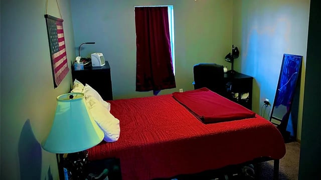 Bed American flag lamp mirror bedroom at Big Green Properties in Huntington Student Accommodation