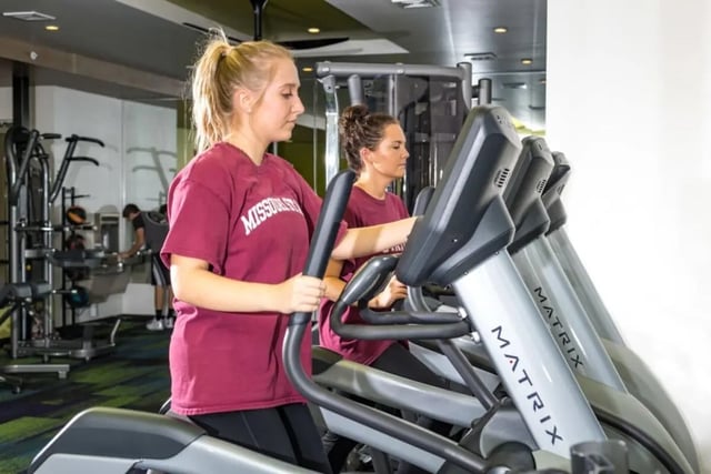 Women exercising on elliptical machines gym at Beacon Commons in Springfield Student Accommodation