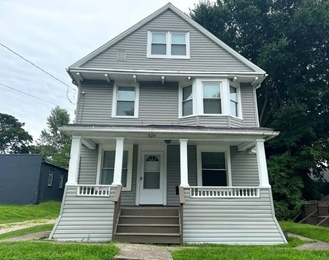 Two story house with porch and stairs exterior at Braymor Student Housing in Akron Student Accommodation