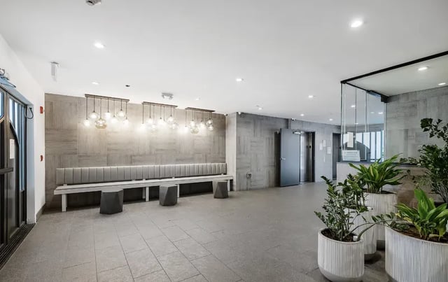 Modern lobby with bench and plants lobby at 1025 Berendo Villas in Los Angeles Student Accommodation