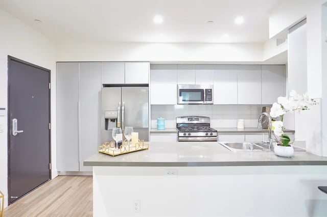 Stainless steel appliances modern cabinets countertop decor kitchen at 1025 Berendo Villas in Los Angeles Student Accommodation