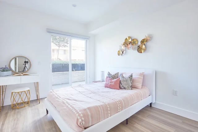 White bed vanity gold stool bedroom at 1025 Berendo Villas in Los Angeles Student Accommodation
