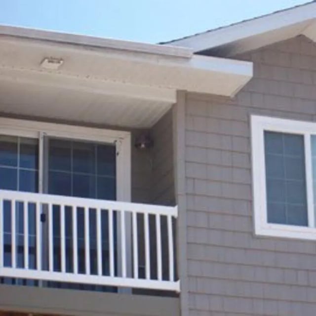 White balcony railing sliding door exterior at Biondo Properties, LLC in La Crosse Student Accommodation