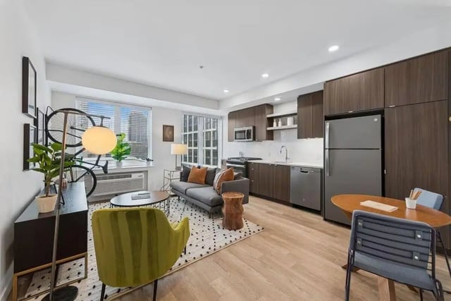 Sofa kitchen appliances rug living room interior at Alta Peak in Portland Student Accommodation