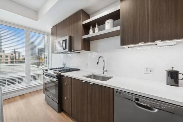 Modern kitchen with dark cabinets oven and sink kitchen at Alta Peak in Portland Student Accommodation