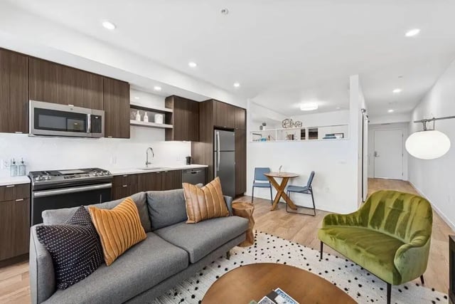 Sofa kitchen dining area living room at Alta Peak in Portland Student Accommodation