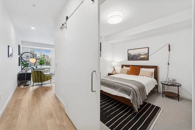 Bed with art and side table Bedroom at Alta Peak in Portland Student Accommodation