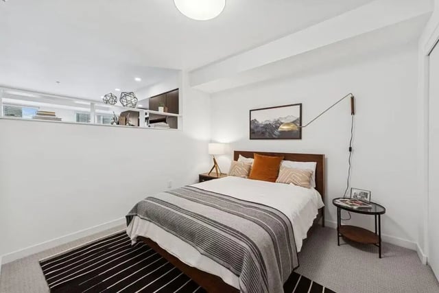 Bed with striped blanket nightstand table picture bedroom at Alta Peak in Portland Student Accommodation
