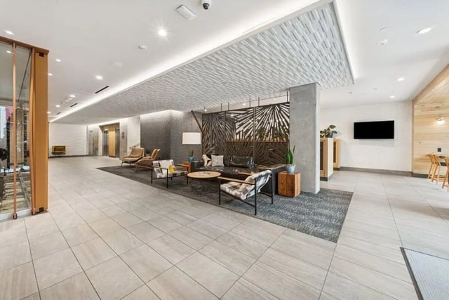 Lobby with seating area elevators and TV common area at Alta Peak in Portland Student Accommodation