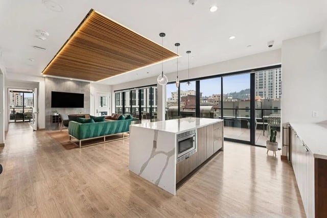 Modern kitchen island with microwave living room living room at Alta Peak in Portland Student Accommodation