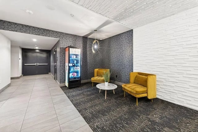 Vending machine lounge area with two chairs exterior at Alta Peak in Portland Student Accommodation