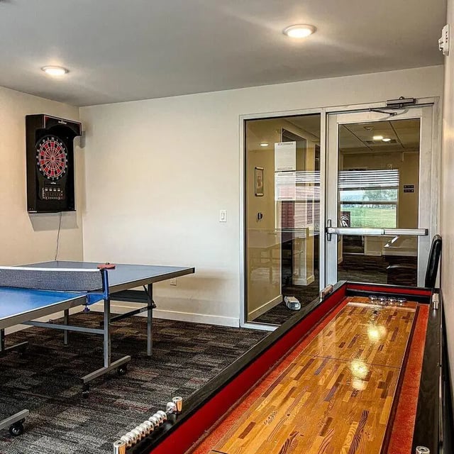 Ping pong table dartboard shuffleboard playing area at Advantage Point Student Apartments in Kutztown Student Accommodation