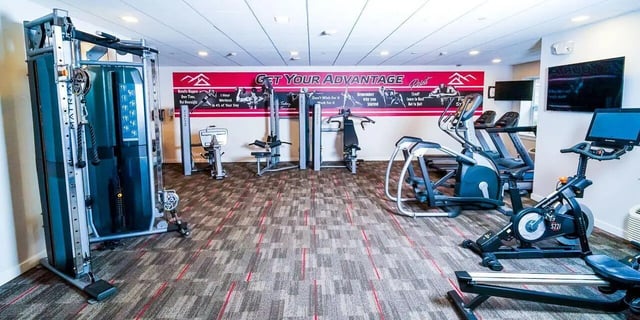 Various exercise machines in fitness room at Advantage Point Student Apartments in Kutztown Student Accommodation