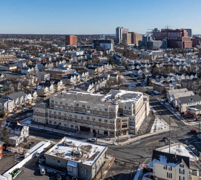 Modern building surrounded by suburban houses exterior at 44 Courtlandt in New Brunswick Student Accommodation