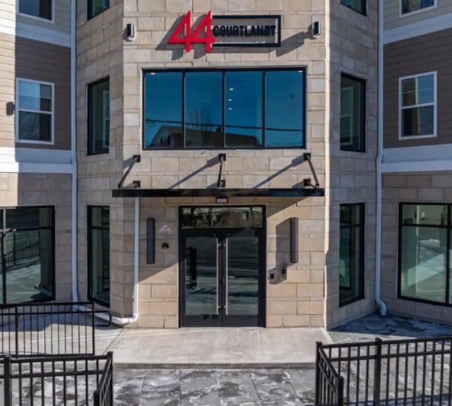 Modern building entrance with large windows exterior at 44 Courtlandt in New Brunswick Student Accommodation