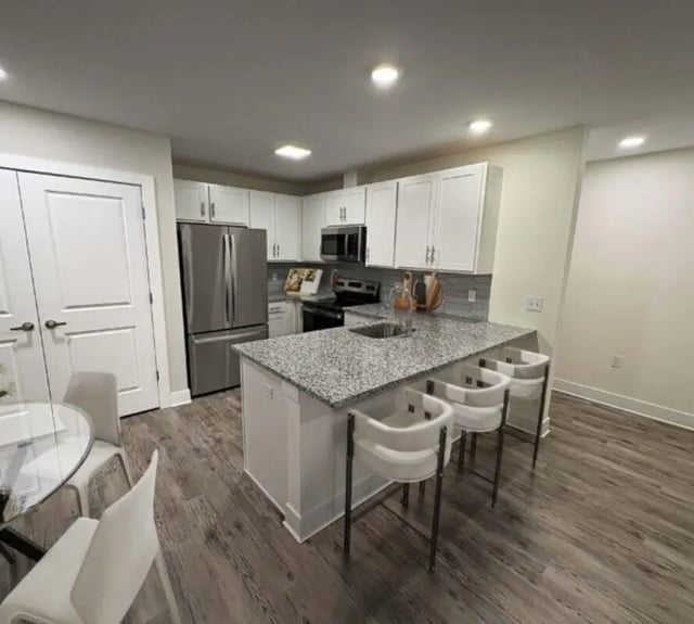 Modern kitchen with granite island stainless steel appliances kitchen at 44 Courtlandt in New Brunswick Student Accommodation