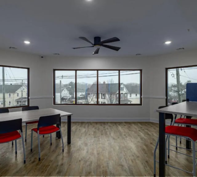 Tables and chairs with red cushions common area at 44 Courtlandt in New Brunswick Student Accommodation