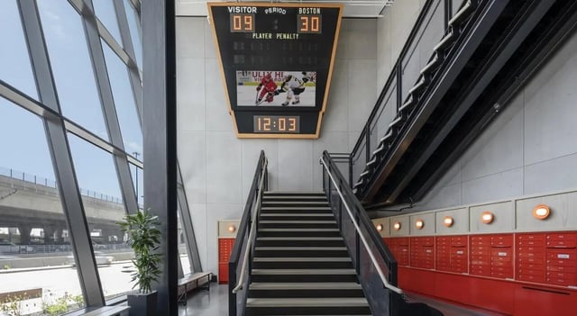 Scoreboard stairs lockers and windows interior at 7 INK in Boston Student Accommodation