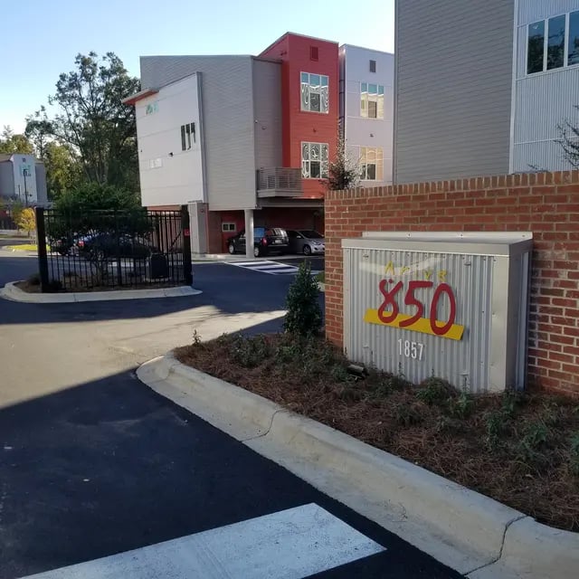 Modern apartment buildings with address sign exterior at Arive850 in Tallahassee Student Accommodation