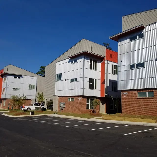 Modern student housing complex with brick and white siding exterior exterior at Arive850 in Tallahassee Student Accommodation