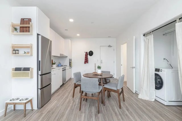 Kitchen dining area with washing machine laundry area at 11 East Pleasant in Amherst Student Accommodation