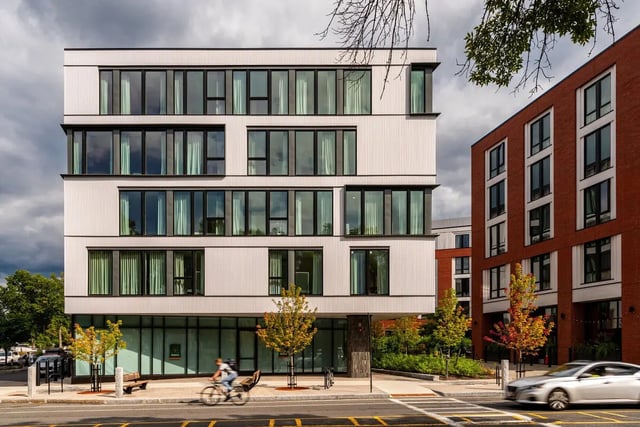 Modern white and red buildings exterior with windows exterior at 11 East Pleasant in Amherst Student Accommodation