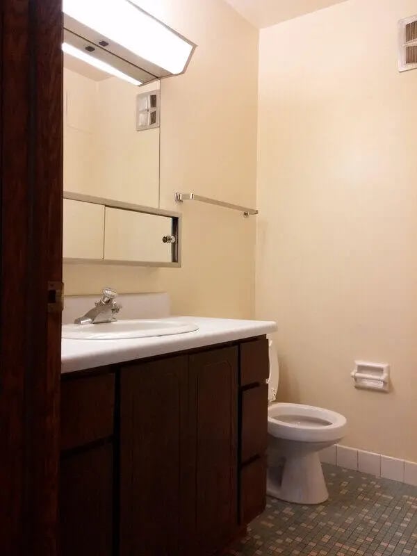 Sink vanity toilet towel rack bathroom at Campus Court in Milwaukee Student Accommodation