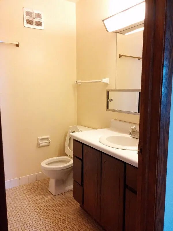 Toilet sink vanity and mirror bathroom at Campus Court in Milwaukee Student Accommodation