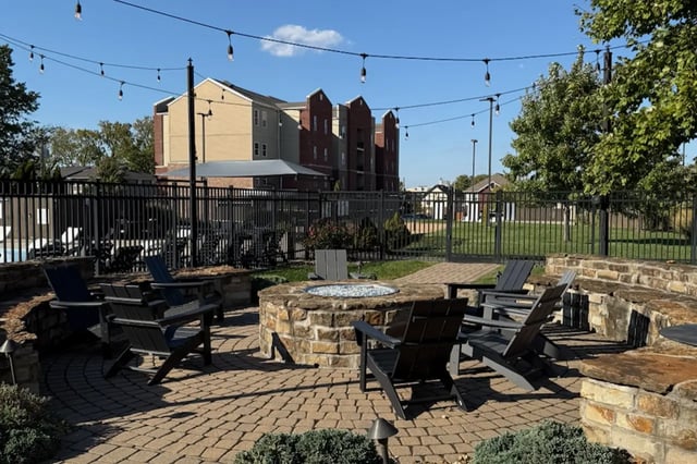 Outdoor seating area with fire pit exterior at Bear Village Apartments in Springfield Student Accommodation