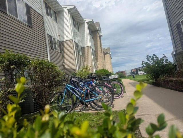 Several bicycles parked near student housing exterior at Crimson Villas in Pittsburg Student Accommodation