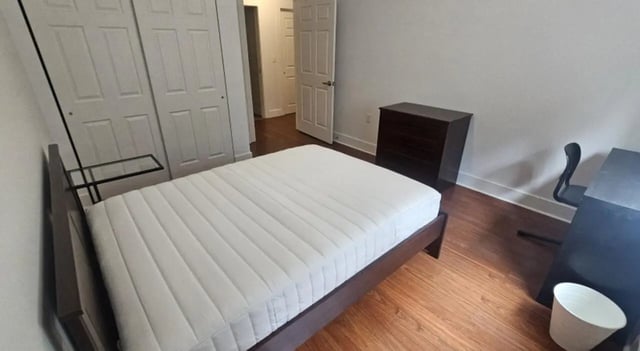 Bed dresser desk and chair bedroom at Clyde Street Apartments in Pittsburgh Student Accommodation