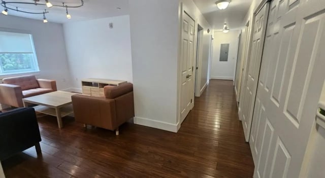 Sofa coffee table and hallway living room at Clyde Street Apartments in Pittsburgh Student Accommodation