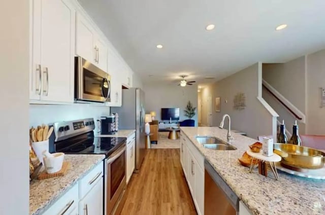 Modern kitchen with stainless steel appliances and island Kitchen at 11 at Main in Winterville Student Accommodation